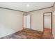 Bedroom with wood-look flooring and doors leading to other rooms and closets at 282 Marion Rd, Dorchester, SC 29437