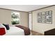 Comfortable bedroom featuring a well-made bed and art decorations on the wall at 282 Marion Rd, Dorchester, SC 29437