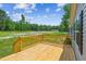 Spacious wooden deck offering scenic views of the backyard and surrounding greenery at 282 Marion Rd, Dorchester, SC 29437