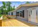 Beautiful wooden deck with access to the home and offers outdoor relaxation and entertainment space at 282 Marion Rd, Dorchester, SC 29437