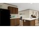 Modern kitchen featuring granite countertops, dark cabinetry, and a functional center island at 282 Marion Rd, Dorchester, SC 29437