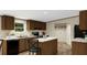 Well-equipped kitchen with stainless steel appliances, dark cabinets, and center island at 282 Marion Rd, Dorchester, SC 29437