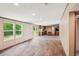Bright living room featuring hardwood floors and an open floor plan to the kitchen and sliding glass door at 282 Marion Rd, Dorchester, SC 29437