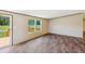 Spacious living room with hardwood floors, a sliding glass door, and ample natural light at 282 Marion Rd, Dorchester, SC 29437