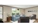 Bright living room featuring comfortable blue sofa and stylish decor, creating a cozy atmosphere at 282 Marion Rd, Dorchester, SC 29437