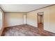 Comfortable living room featuring wood-look flooring and a door leading to another room at 282 Marion Rd, Dorchester, SC 29437