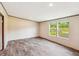 Bright living room with wood-look flooring and scenic views from the windows at 282 Marion Rd, Dorchester, SC 29437