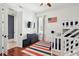 Charming bedroom features a bunk bed, hardwood floors, and a cool accent rug at 3 Cross Ln, Isle of Palms, SC 29451