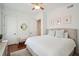 This beautiful bedroom has hardwood floors, a large bed, and classic décor at 3 Cross Ln, Isle of Palms, SC 29451