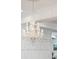 Ornate crystal chandelier illuminating the entryway at 3 Cross Ln, Isle of Palms, SC 29451
