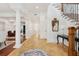 Bright foyer with columns, staircase, table, and mirror at 3 Cross Ln, Isle of Palms, SC 29451