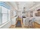 Gourmet kitchen featuring custom cabinets, quartz countertops, and stainless steel appliances at 3 Cross Ln, Isle of Palms, SC 29451
