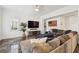 Cozy living room features a large sectional sofa and entertainment center for relaxation at 3 Cross Ln, Isle of Palms, SC 29451