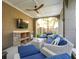 Inviting covered patio with comfortable seating, a TV, and a built-in beverage center at 3 Cross Ln, Isle of Palms, SC 29451