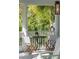 Relaxing porch with bistro table and chairs with white railings at 3 Cross Ln, Isle of Palms, SC 29451