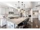 Modern kitchen featuring granite countertops, an island with bar stools, and stainless steel appliances at 301 Dunlin Dr, Summerville, SC 29486