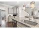 Stylish kitchen with granite countertops, stainless steel sink, and custom cabinets at 301 Dunlin Dr, Summerville, SC 29486