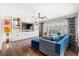 Stylish living room with custom built-ins, a large sectional, and sliding glass doors to the patio at 301 Dunlin Dr, Summerville, SC 29486