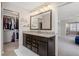 Elegant main bathroom with dual sinks, granite countertops, and a large mirror at 301 Dunlin Dr, Summerville, SC 29486