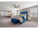 Serene main bedroom with a sitting area, a plush bed, and plantation shutters at 301 Dunlin Dr, Summerville, SC 29486