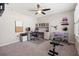 Functional office with built-in desk, shelving, weights, and mounted television at 301 Dunlin Dr, Summerville, SC 29486