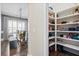Well-organized pantry with white shelving and ample storage space for food and household items at 301 Dunlin Dr, Summerville, SC 29486