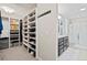 Spacious walk-in closet with custom shelving and drawers, providing ample storage solutions at 301 Dunlin Dr, Summerville, SC 29486