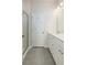 Modern bathroom with double sink vanity, tile floors, and glass enclosed shower at 304 Pathfinder Way, Charleston, SC 29492