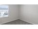 Simple carpeted bedroom with a window and neutral walls at 304 Pathfinder Way, Charleston, SC 29492
