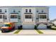 View of townhome exteriors with garages and balconies; note the varying neutral color schemes at 304 Pathfinder Way, Charleston, SC 29492