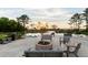 Relaxing fire pit area with cozy seating and water feature in a quiet community at 304 Pathfinder Way, Charleston, SC 29492