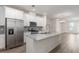 Modern kitchen boasts stainless steel appliances, granite countertops, and ample storage space at 304 Pathfinder Way, Charleston, SC 29492
