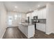 Modern kitchen with white cabinetry, stainless appliances, and a granite-topped island at 304 Pathfinder Way, Charleston, SC 29492