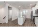 Modern kitchen with white cabinetry, stainless appliances, and an island with seating space at 304 Pathfinder Way, Charleston, SC 29492