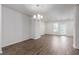 Spacious living room with hardwood floors and a modern chandelier at 304 Pathfinder Way, Charleston, SC 29492