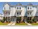 Charming townhomes with individual balconies, tidy landscaping, and welcoming entrances at 304 Pathfinder Way, Charleston, SC 29492