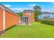 A cozy backyard with a fire pit and screened in porch, perfect for relaxing and entertaining at 309 Harriswood Ln, Moncks Corner, SC 29461