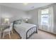 Cozy bedroom with neutral colors, a comfortable bed, and a sunny window at 309 Harriswood Ln, Moncks Corner, SC 29461