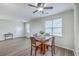 Open-concept dining area featuring a wooden table, comfortable seating, and abundant natural light at 309 Harriswood Ln, Moncks Corner, SC 29461