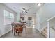 Bright dining area leading to the kitchen, complete with a modern ceiling fan and ample natural light at 309 Harriswood Ln, Moncks Corner, SC 29461