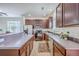 Spacious kitchen featuring stainless steel appliances, dark wood cabinets, and ample counter space at 309 Harriswood Ln, Moncks Corner, SC 29461