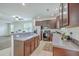 Kitchen with dark cabinetry, stainless steel appliances, and an open layout to the living area at 309 Harriswood Ln, Moncks Corner, SC 29461