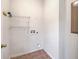 Empty laundry room with tile flooring, wire shelving, and washer and dryer hookups at 309 Harriswood Ln, Moncks Corner, SC 29461