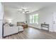 Bright and airy living room with neutral tones, stylish furniture, and ample natural light at 309 Harriswood Ln, Moncks Corner, SC 29461