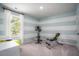 Bright bedroom used as a workout space with exercise bike and bench at 321 Tiliwa St, Summerville, SC 29486