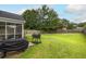 Large grassy backyard with a patio, perfect for outdoor entertaining at 3257 Timberline Dr, Johns Island, SC 29455