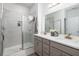 Bathroom includes dual vanity sinks and tiled stand-up shower with glass door at 3257 Timberline Dr, Johns Island, SC 29455