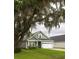 Charming single-Gathering home with manicured lawn beneath the shade of a majestic tree at 3257 Timberline Dr, Johns Island, SC 29455