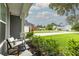 Inviting front porch seating area with views of a lush, green neighborhood at 3257 Timberline Dr, Johns Island, SC 29455