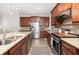 Modern kitchen features stainless appliances, granite countertops, and wood cabinets at 3257 Timberline Dr, Johns Island, SC 29455